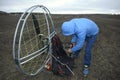 Man paramotorist preparing the paramotor for flight