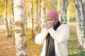 Man in park blowing his nose Royalty Free Stock Photo