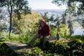 A man in the park enjoys drinking mate from a cup of Mate. Royalty Free Stock Photo