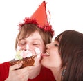 Man in party hat and girl eating cake. Royalty Free Stock Photo