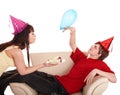 Man in party hat and girl eating cake. Royalty Free Stock Photo