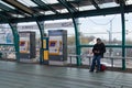 Man passenger waiting on the platform of a railway metro station for train