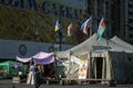 Man passing near a Euromaidan barricade and tent on khreschatyk street after the revolution & protests on Maidan Square