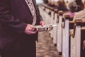 Man passing the offering plate in a traditional American church Royalty Free Stock Photo