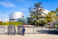 A man is passing the security turnstile of the European Court of Human Rights building in Strasbourg, France Royalty Free Stock Photo