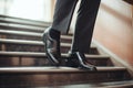 Man in patent leather shoes. Feet go down stairs. Successful person walking to business meeting. Businessman wearing Royalty Free Stock Photo