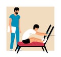 Man patient doing exercises under the supervision of doctor