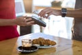 Man paying bill through smartphone using NFC technology Royalty Free Stock Photo