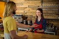 Man paying bill through smartphone using NFC technology Royalty Free Stock Photo