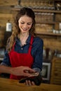 Man paying bill through smartphone using NFC technology Royalty Free Stock Photo