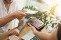 Man paying bill through smartphone using NFC technology Royalty Free Stock Photo