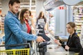 Man paying with contactless card in a grocery store Royalty Free Stock Photo