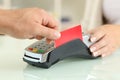 Man paying with credit card reader in a shop