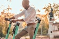 Man is paying for electro scooter using his mobile phone Royalty Free Stock Photo