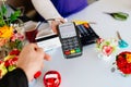 Man paying for flowers with his debit card. Royalty Free Stock Photo