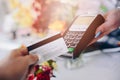 Man paying for flowers with his debit card. Royalty Free Stock Photo