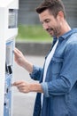 man paying for gasoline in gas station pump Royalty Free Stock Photo