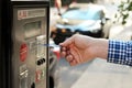 Man is paying his parking using credit card at parking pay station terminal. Royalty Free Stock Photo