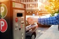 Man is paying his parking using credit card at parking pay station terminal. Royalty Free Stock Photo