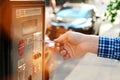 Man is paying his parking using credit card at parking pay station terminal. Royalty Free Stock Photo