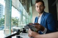 Man paying his waiter with a card and nfc technology