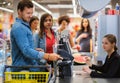 Man paying with NFC in a grocery store Royalty Free Stock Photo