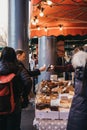 Man paying for the purchases with contactless card at a stall in Borough Market, London, UK