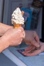 Man paying woman for ice cream with chocolate Royalty Free Stock Photo