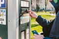 Man pays for parking with a credit card with NFS technology. Easy payment. Process of paying in machine parking terminal. Payment Royalty Free Stock Photo