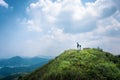 Man on the Peak of Pyramid Hill, Hiking route in Sai Kung, Countryside of Hong Kong Royalty Free Stock Photo