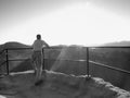 Man on the peak of sandstone rock in national park Royalty Free Stock Photo