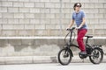 Man pedaling standing on electric bike Royalty Free Stock Photo