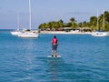 Man on peddle boat in tropics