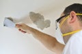 Man Peeling a Ceiling Royalty Free Stock Photo