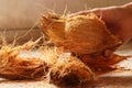 man peeling coconut