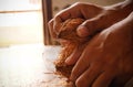 man peeling coconut