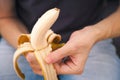 A man peeling a fresh banana. Shallow depth of field Royalty Free Stock Photo