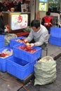 Man is peeling pomegranates in China Royalty Free Stock Photo