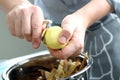 Man peeling potatoes. Kitchen working. Prepare food Royalty Free Stock Photo
