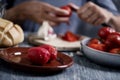 Man peeling scalded tomatoes Royalty Free Stock Photo