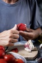 Man peeling scalded tomatoes Royalty Free Stock Photo