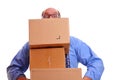 Man peeps over heavy boxes while carrying them Royalty Free Stock Photo