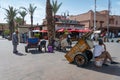 Man and people with wheelbarrows in Marrakech. Morocco, in October 2019 Royalty Free Stock Photo