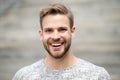 Man with perfect brilliant smile unshaven face defocused background. Guy happy emotional expression outdoors. Bearded