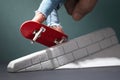 A man performs exercises with a fingerboard on a plaster ramp Royalty Free Stock Photo