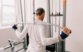 a man performs exercises in the gym on a simulator. back training Royalty Free Stock Photo