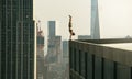 Man performs a handstand on the edge of a skyscraper Royalty Free Stock Photo