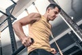 Man performs lifting excercise at the gym. Royalty Free Stock Photo