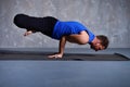 Man performs the pose Padma Mayurasana Royalty Free Stock Photo