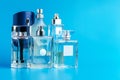 Man perfume bottle on blue background close up Royalty Free Stock Photo